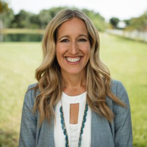 Ivelisse Page, founder of Believe Big, smiles and looks healthy and radiant.