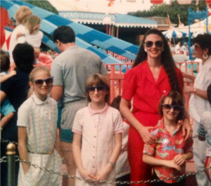 Lynn Eib, author and cancer survivor, poses in a photo from 1989 with her daughters, all of them are wearing sunglasses.